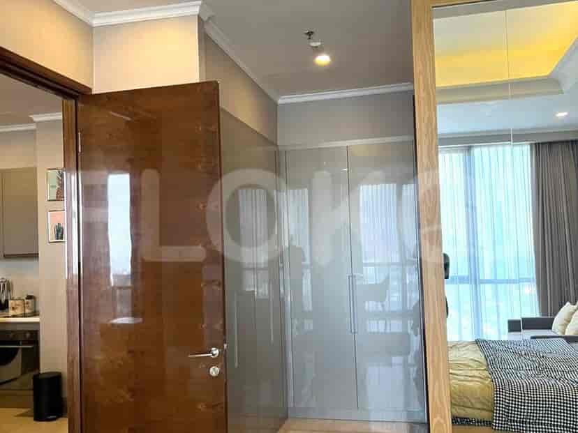 Bedroom featuring a built-in closet, potentially with mirrored doors.