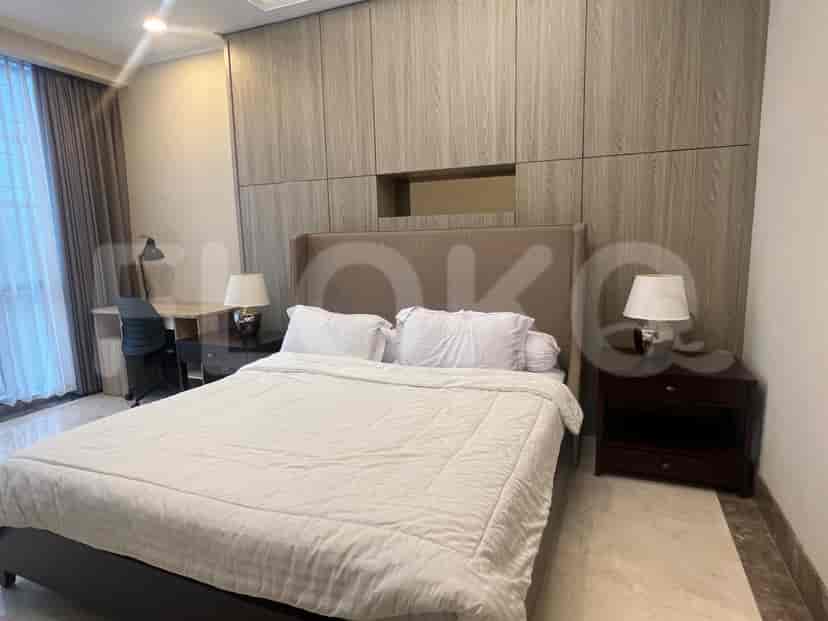 Bedroom with a king-sized bed and large wardrobe.