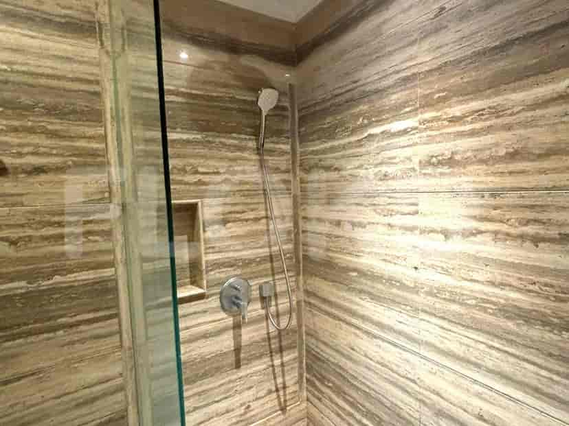 A modern bathroom showcasing a rain shower.