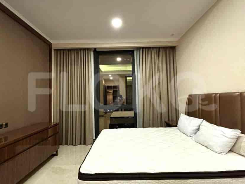 A modern bedroom with a bed, large window, and a dresser.
