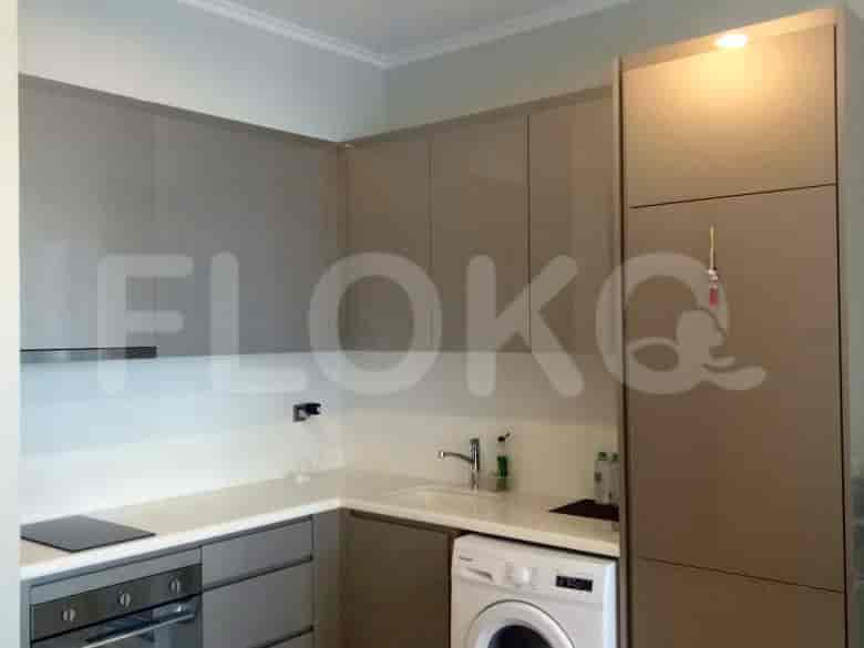 A modern kitchen with cabinets and appliances.