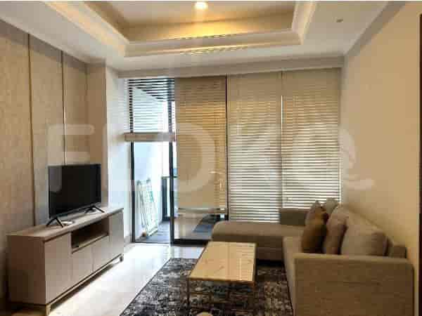 Living room with sofa, TV, coffee table, and blinds.