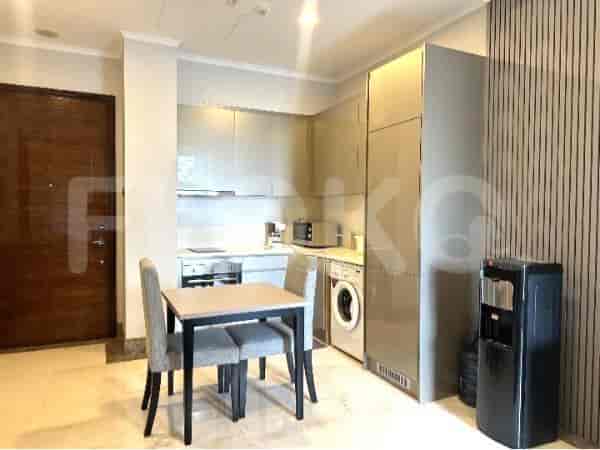 Modern kitchen with cabinets and dining table.