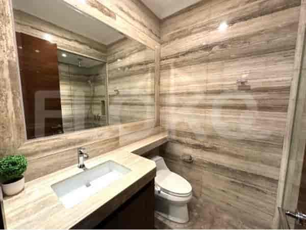 Bathroom featuring a sink, mirror, and toilet.