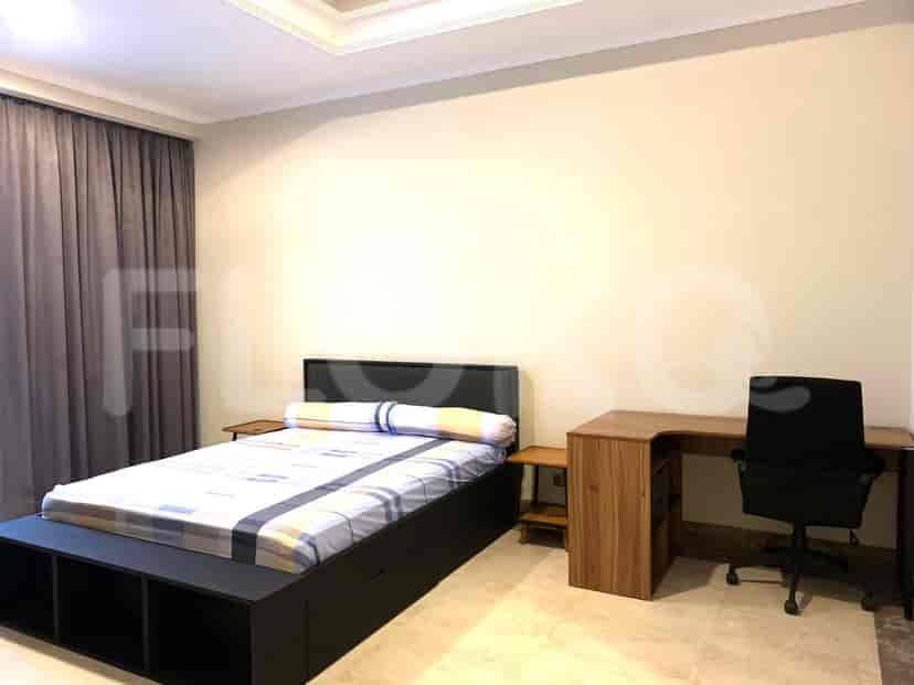 Bedroom with a bed, desk, and chair.