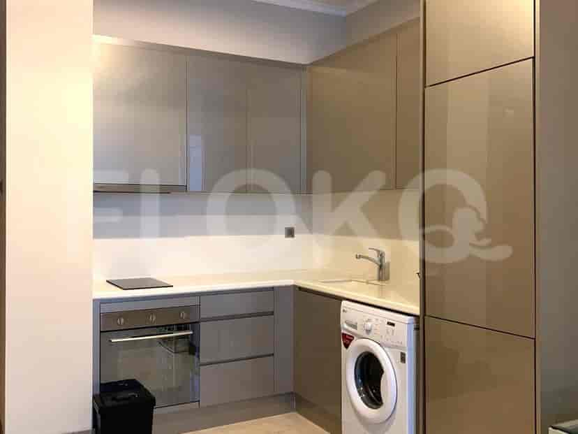 Modern kitchen with cabinets and appliances.