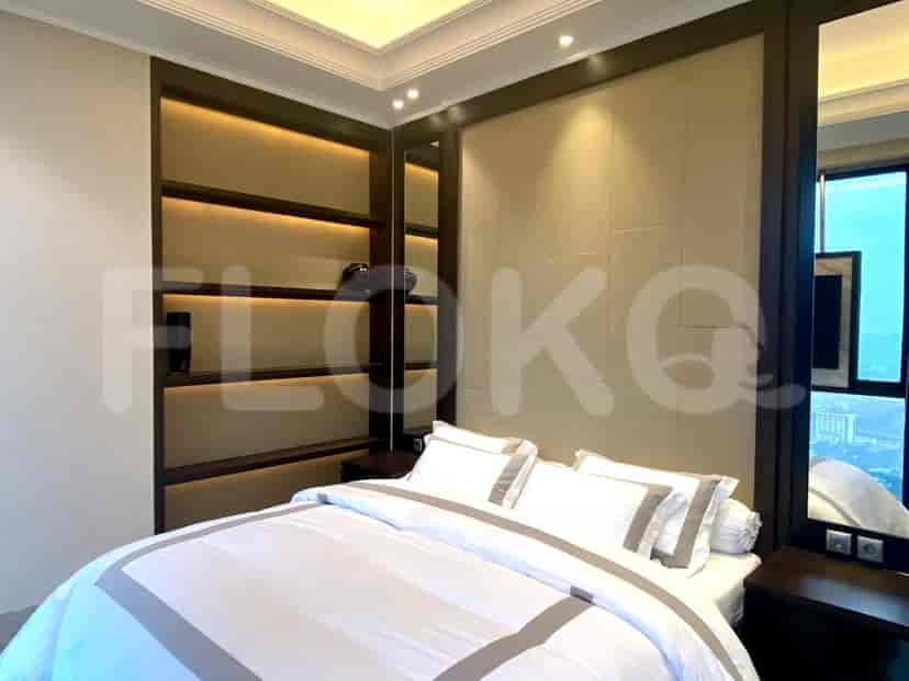 Bedroom with a bed and built-in storage.