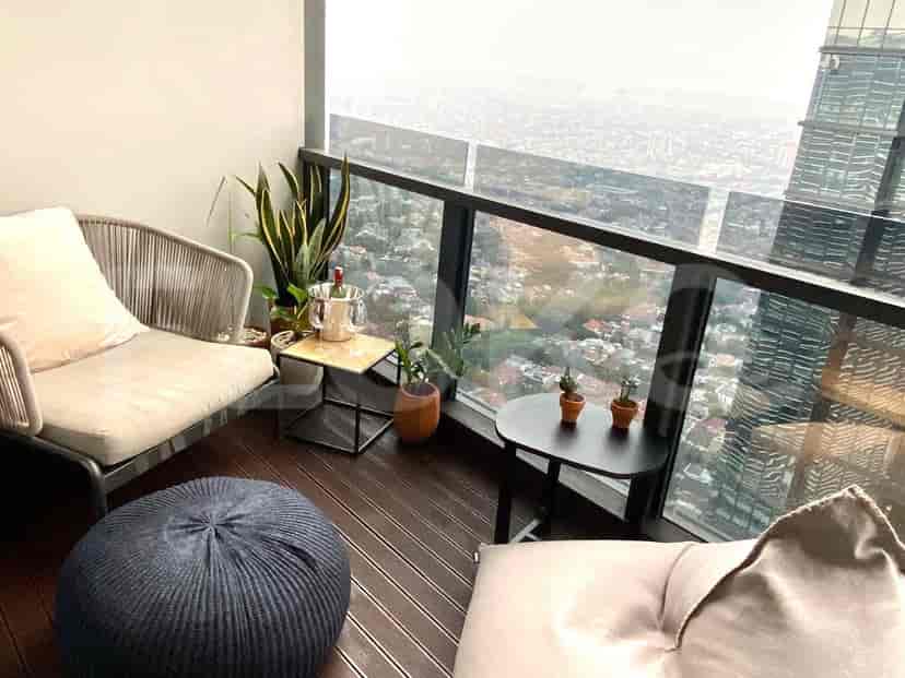 Balcony with seating and a stunning city view.