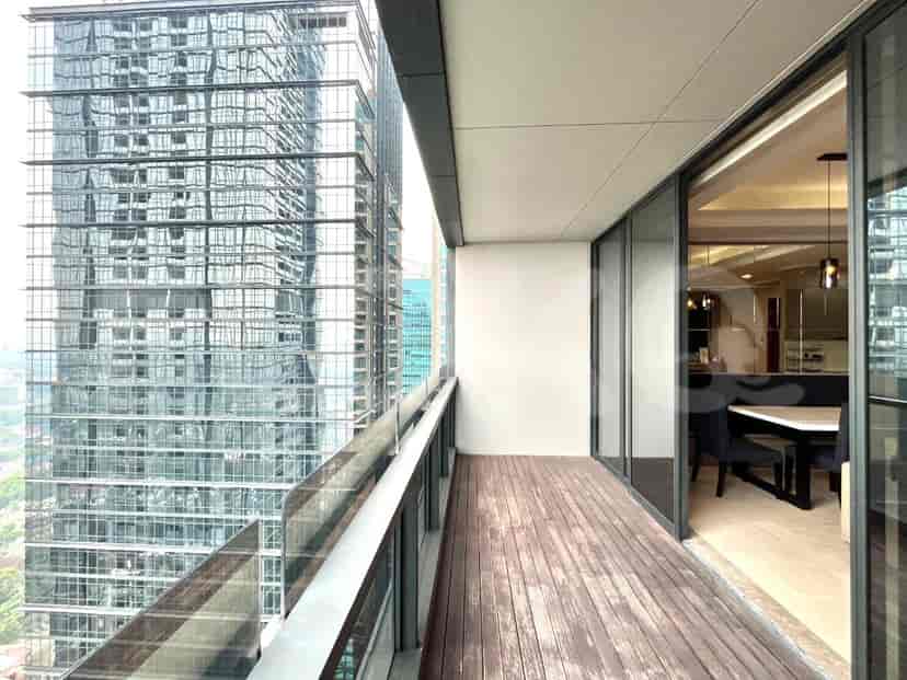 A balcony with a view overlooking a city.