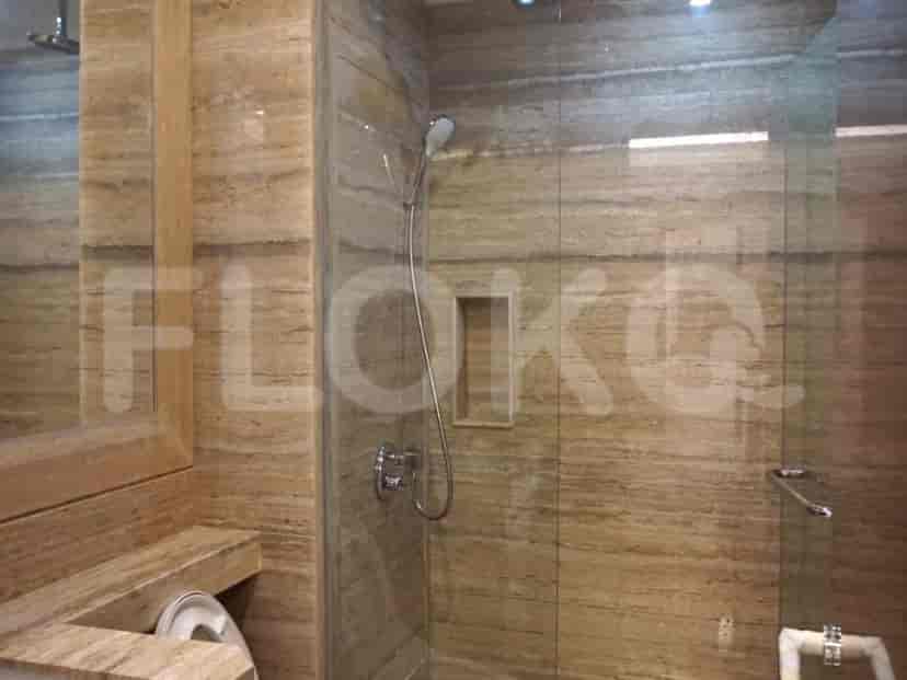 Bathroom with a shower, tile walls and modern fixtures.