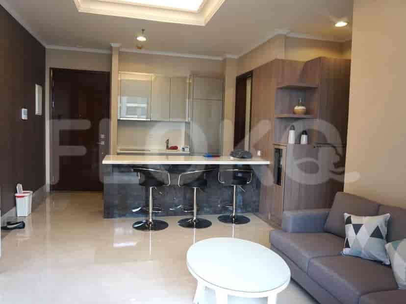 Open kitchen with a breakfast bar, integrated with living area.