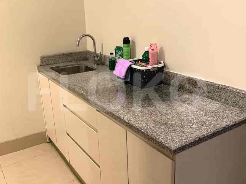 Kitchenette with a stainless steel sink.