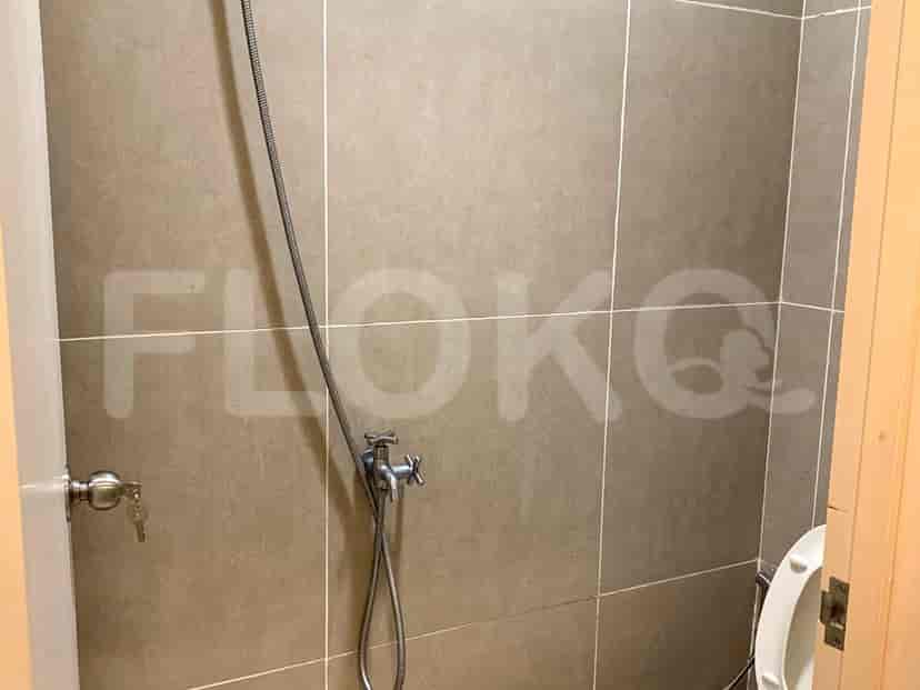 Shower with showerhead and tiles.