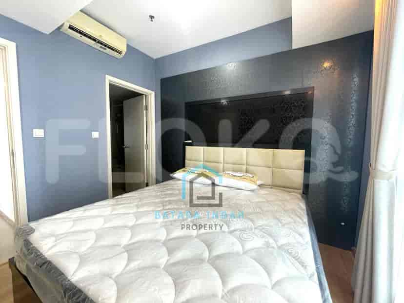 Bedroom with a bed and blue walls.