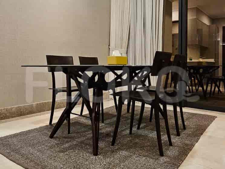 Modern dining room with table and chairs.