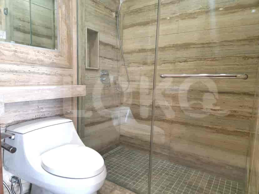 Bathroom with toilet, sink and shower.