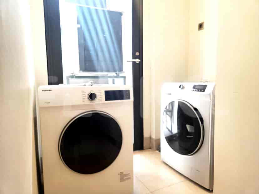 Laundry area with washing machines.