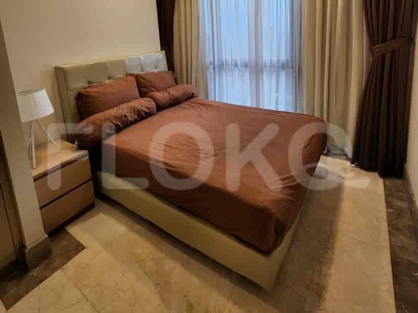 Bedroom with bed, pillows, and night curtains