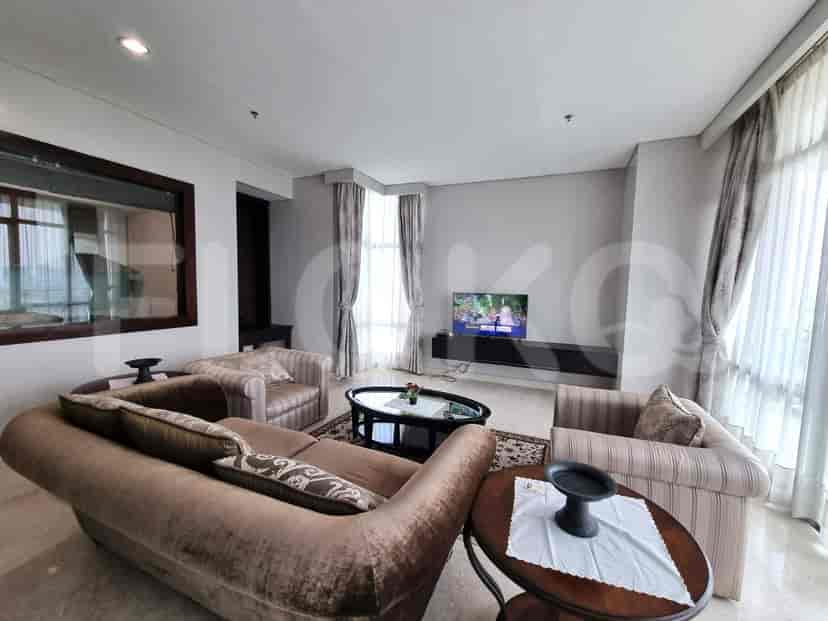Another view of the living room showcasing seating, a coffee table, and a smart TV.