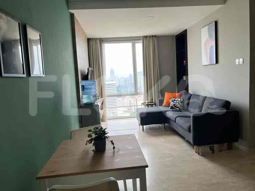 Modern kitchen and dining space, featuring a kitchen counter and a dining table.