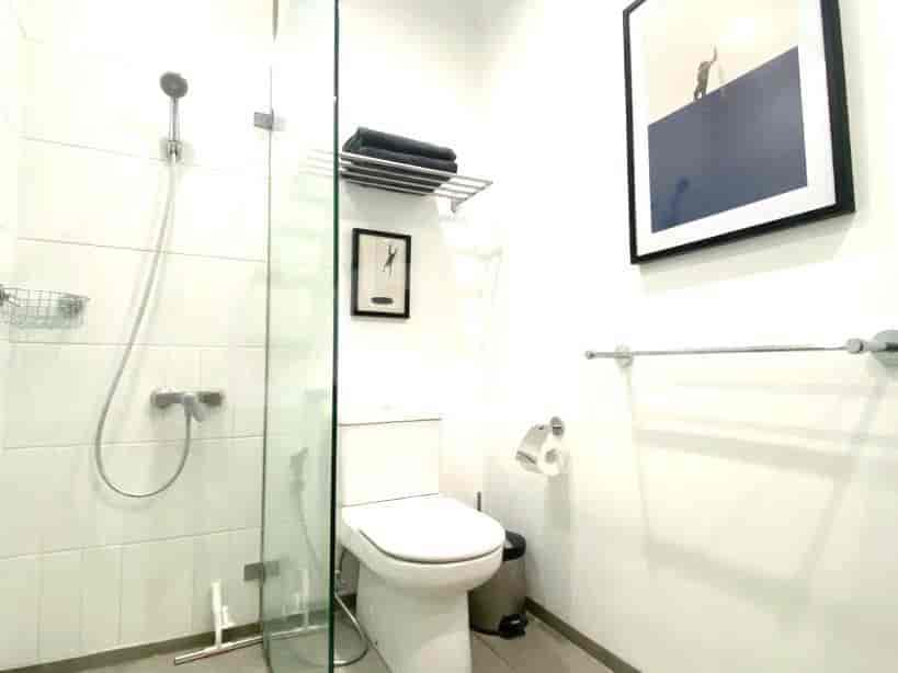Bathroom with a shower, toilet, and a vanity.