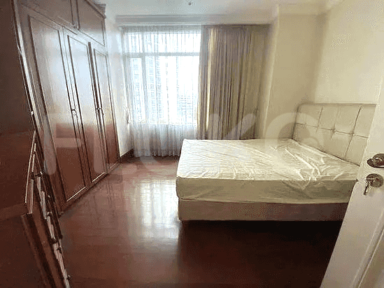 Bedroom with a queen-sized bed and large wardrobe.