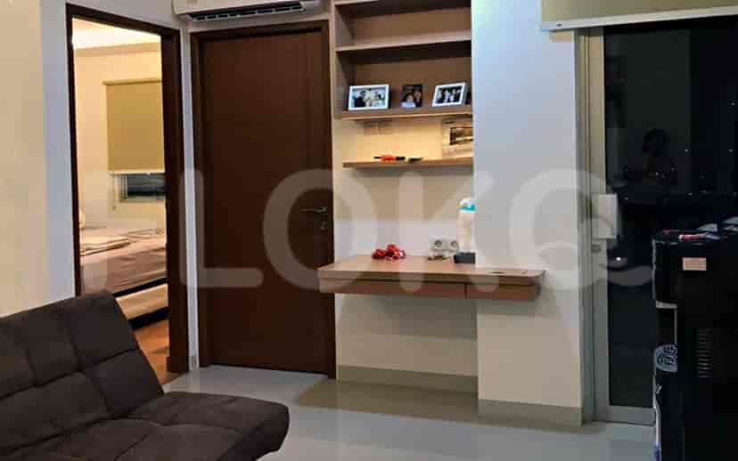 Detailed view of a floating desk with a bookshelf.