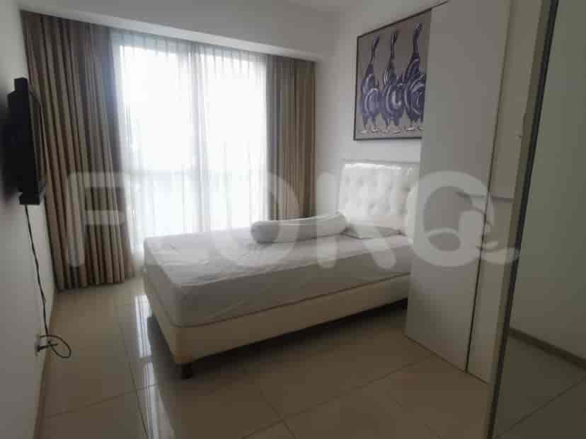 Bedroom with a bed and artwork.