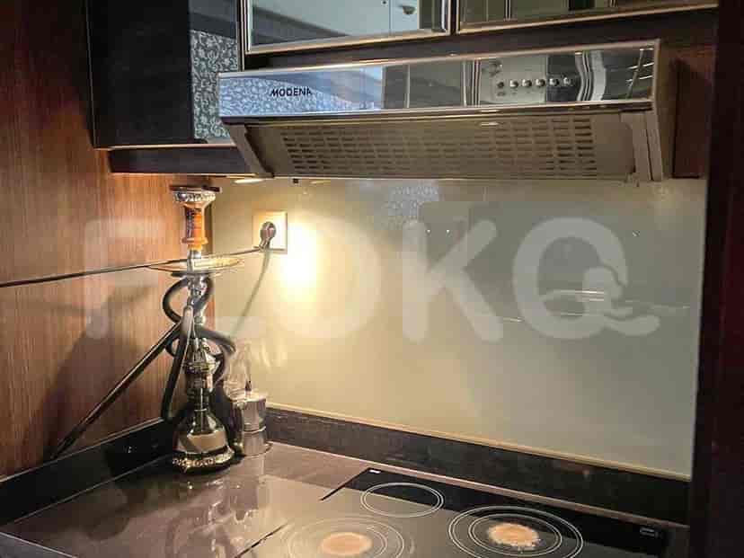 Kitchen with stovetop and range hood.