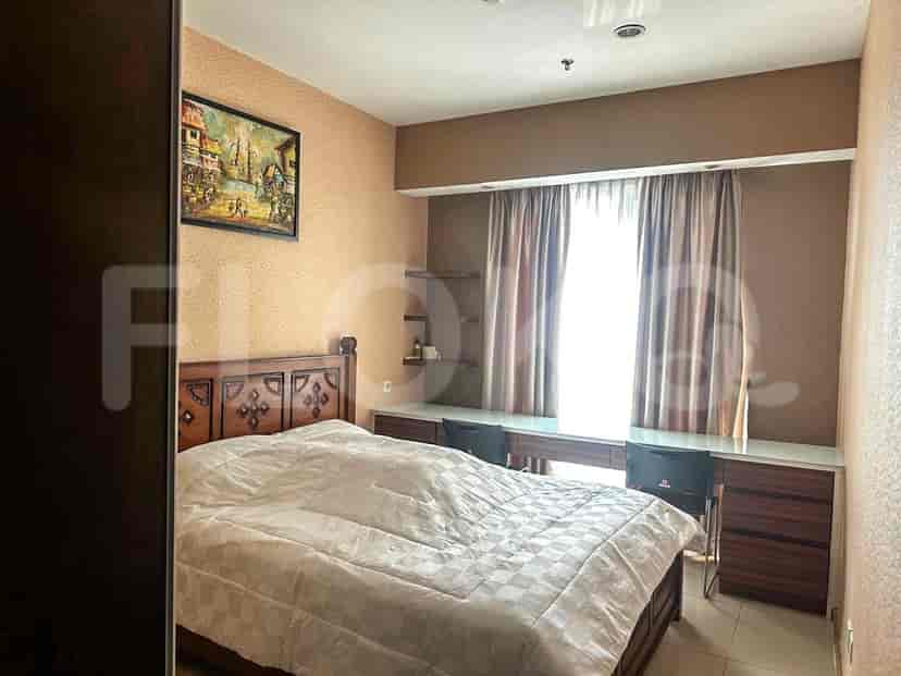 Bedroom with bed and desk.
