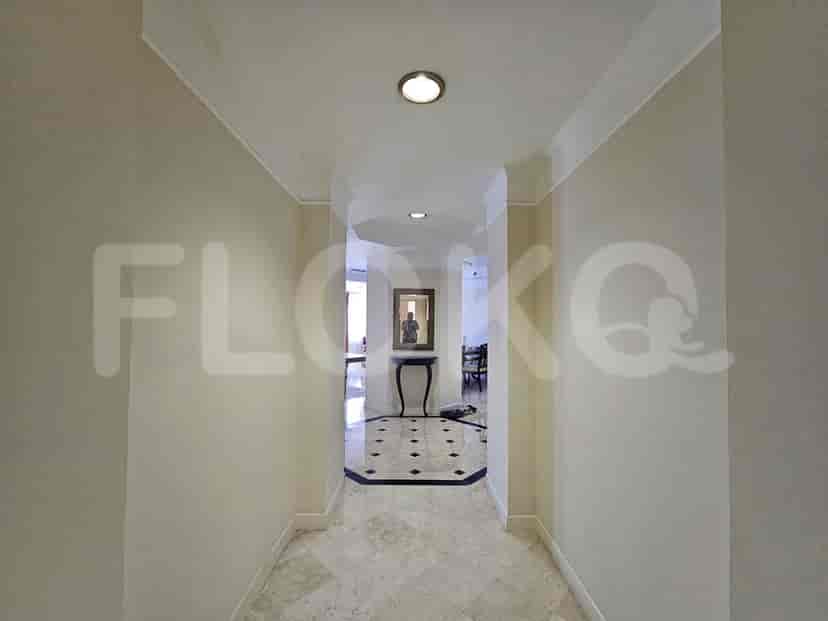 A hallway leading to different rooms.