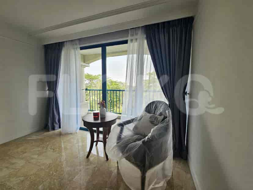The balcony area with a chair.