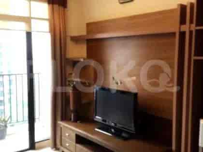 Entertainment center with a TV, along with shelves.