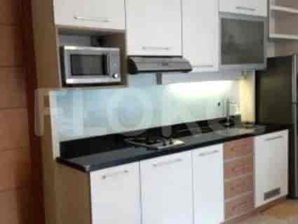 A kitchen with appliances, countertops and cabinets.