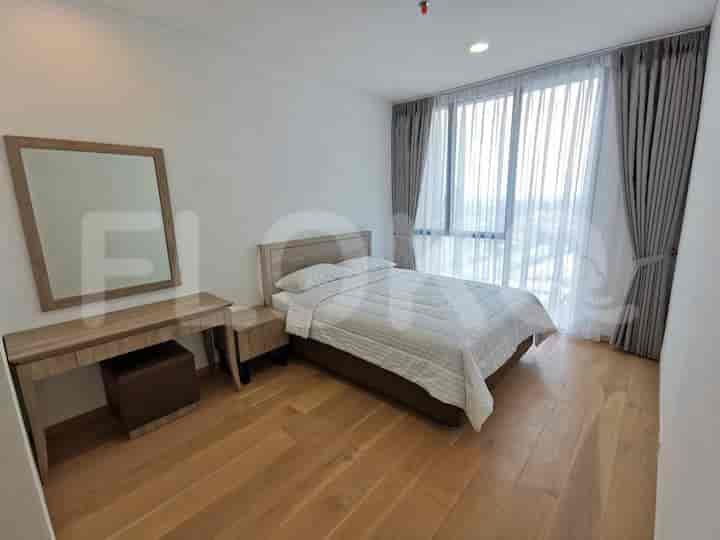 Bedroom with a bed, dresser, and large window.