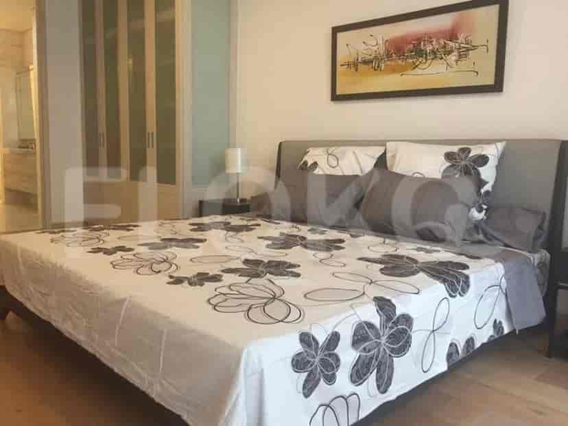 Bedroom with a large bed and elegant bedding.