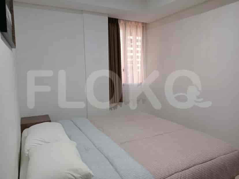 A second bedroom with a double bed and simple decor.