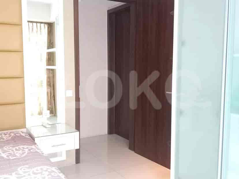 Bedroom doorway, revealing a glimpse of the interior and a mirror.