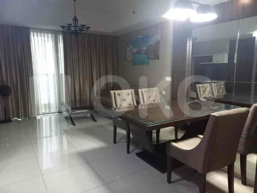 A dining area with a table and chairs.