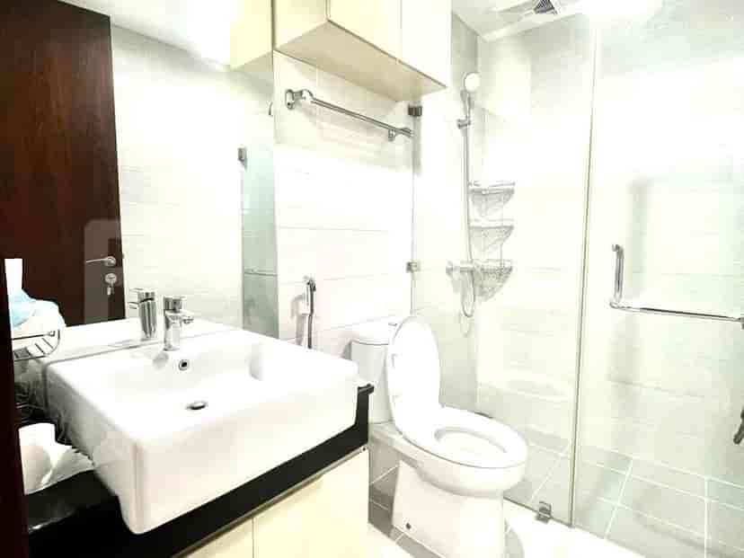 Modern bathroom with a sink and glass shower.