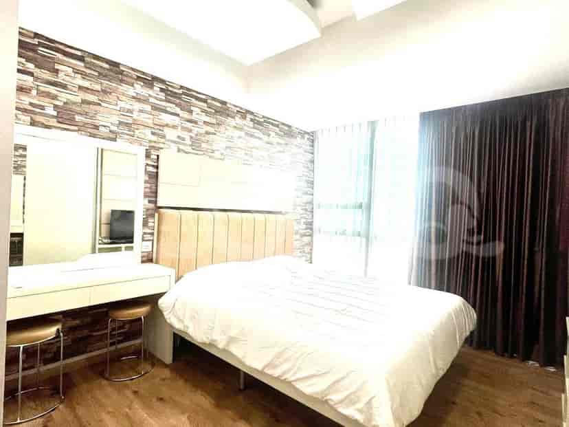 Bedroom with a double bed, vanity, and curtained window.