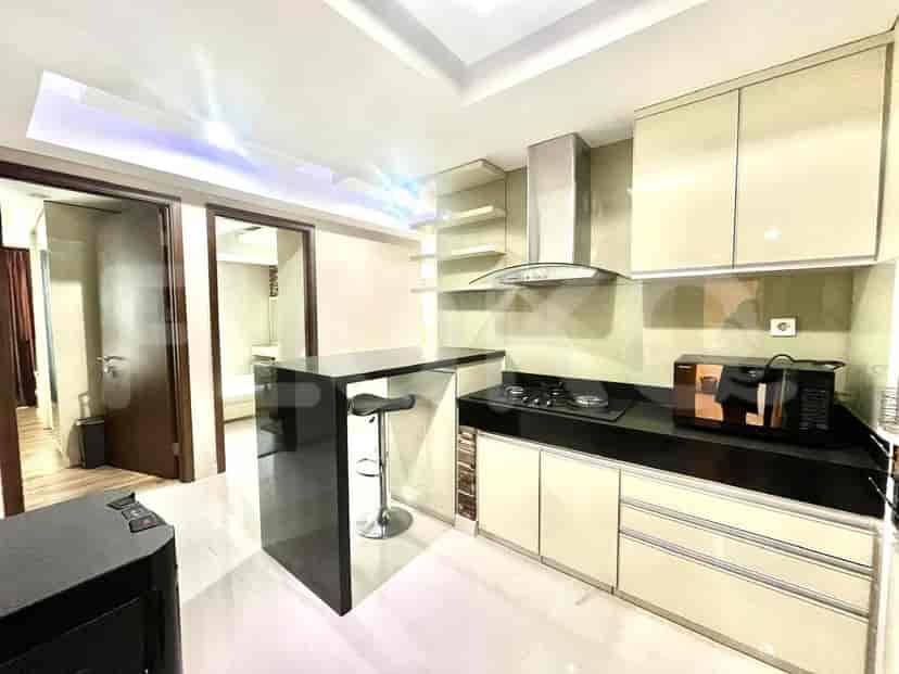 Kitchen area with cabinets and a breakfast bar.