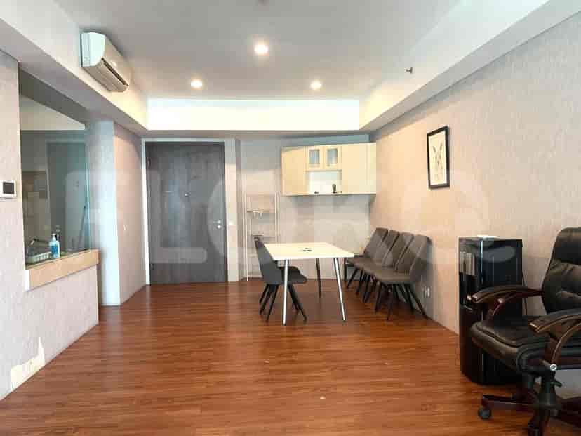 Dining table, chairs, and office setup in an apartment.