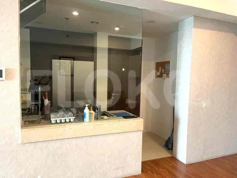 Kitchen area with a breakfast bar and sink.