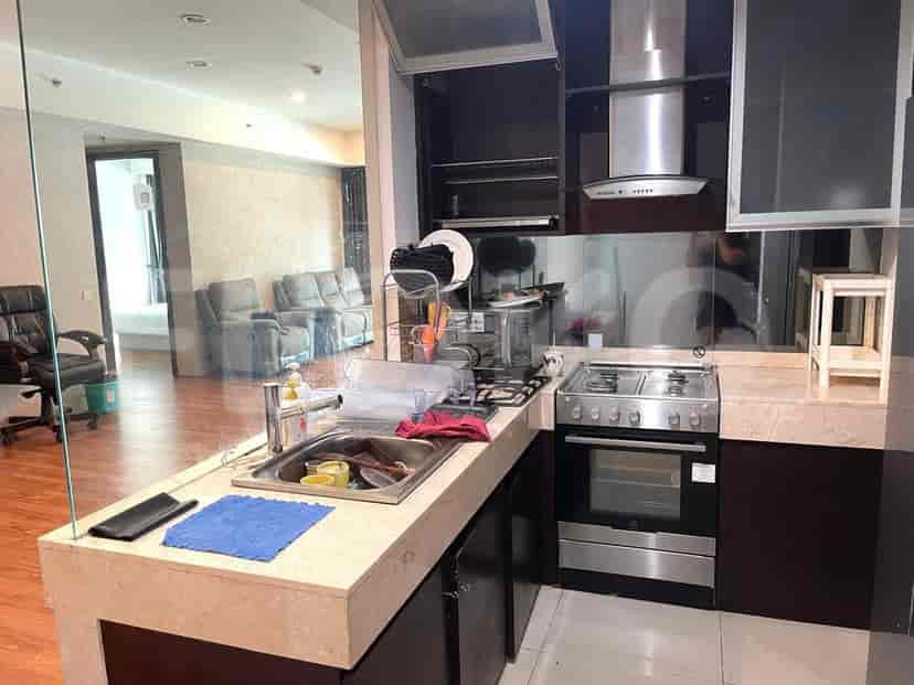 The kitchen layout with a breakfast bar and sink.