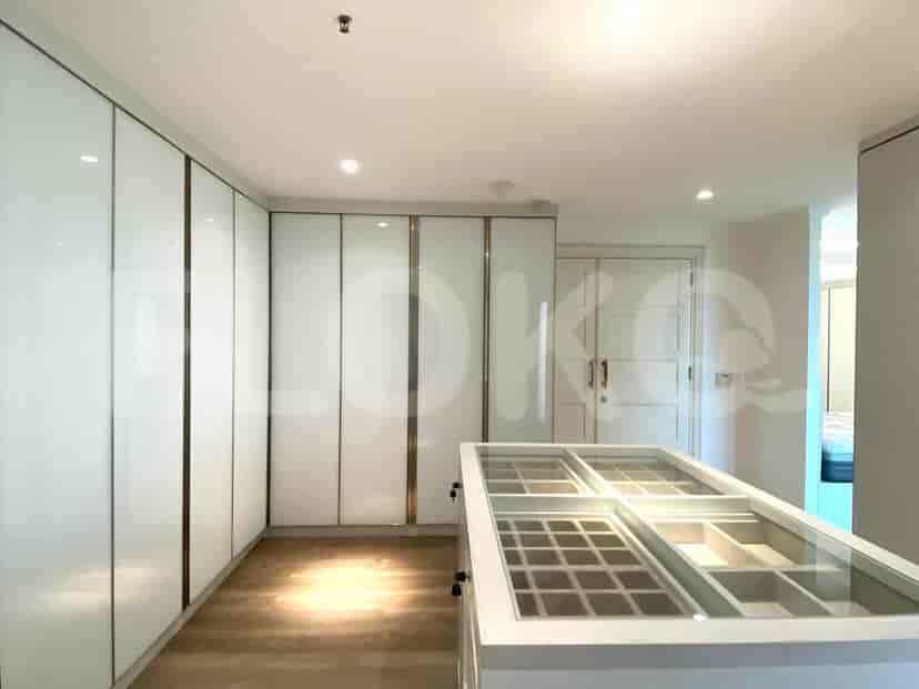 Walk-in closet with ample storage and central island.