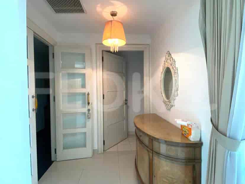 Hallway with a console table and a decorative mirror.