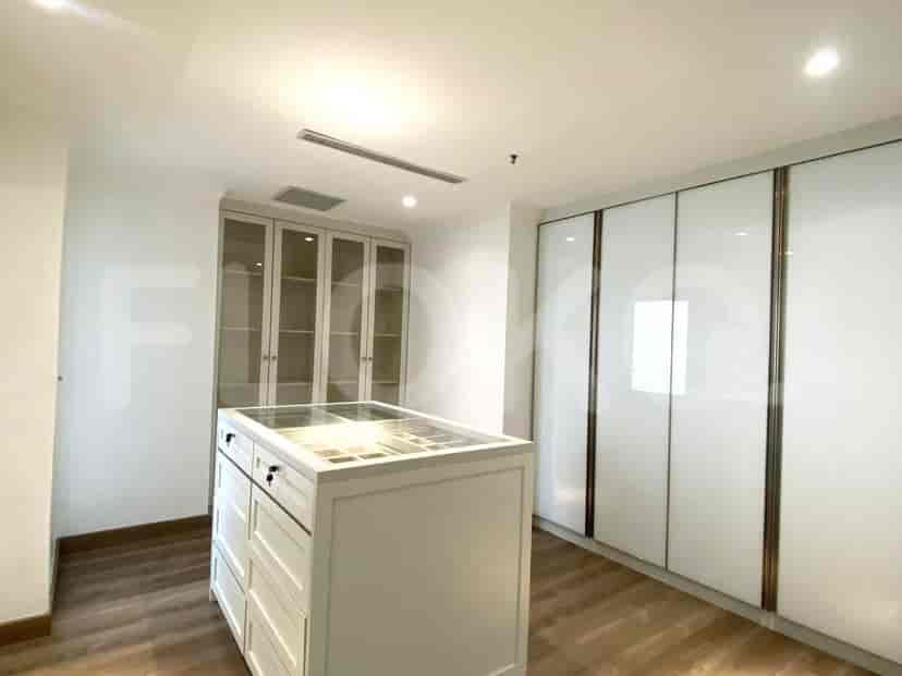 Walk-in closet with drawers and storage space.