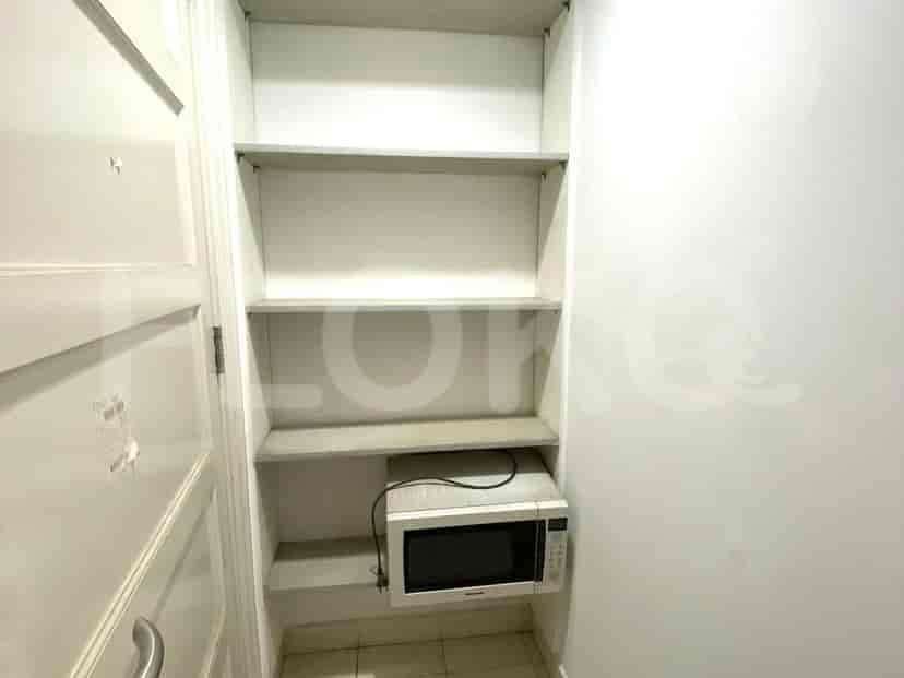 Built-in shelves and a microwave.