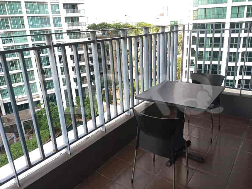 Balcony with a table and chairs.